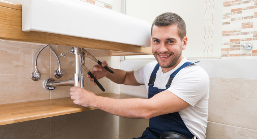 Aquavelle Plumbing Services specialist carefully inspecting a plumbing system